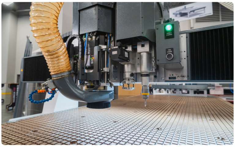 Kimla Madonna CNC router spindle and dust hood over the vacuum table